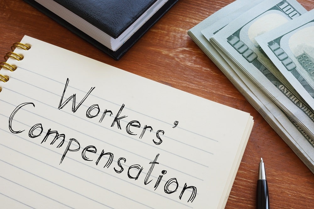 Workers' Compensation is shown on the conceptual business photo