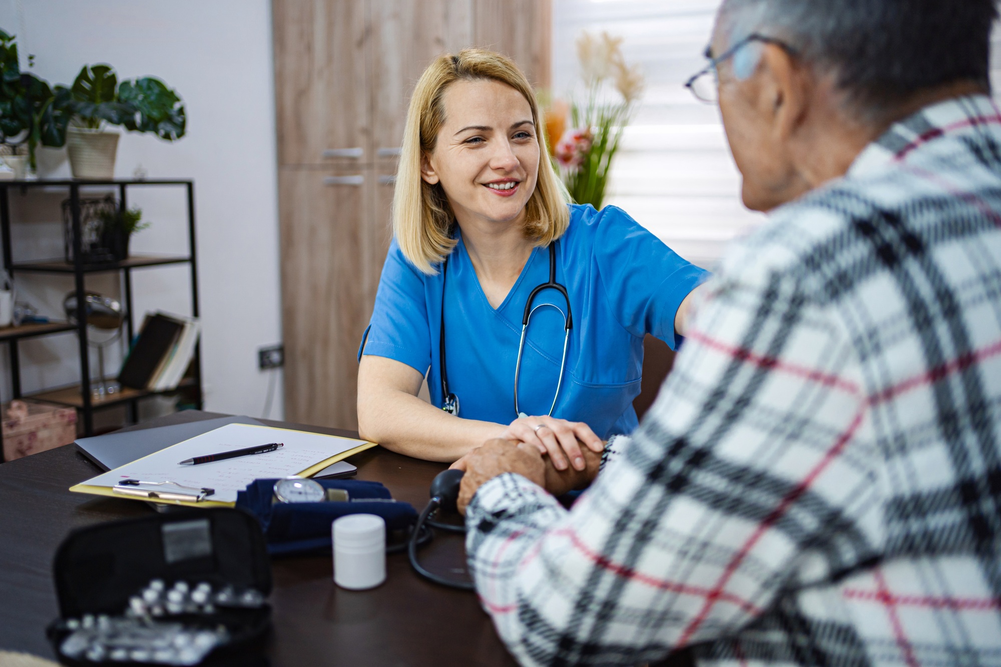 Compassionate caregiver aids senior patient in need