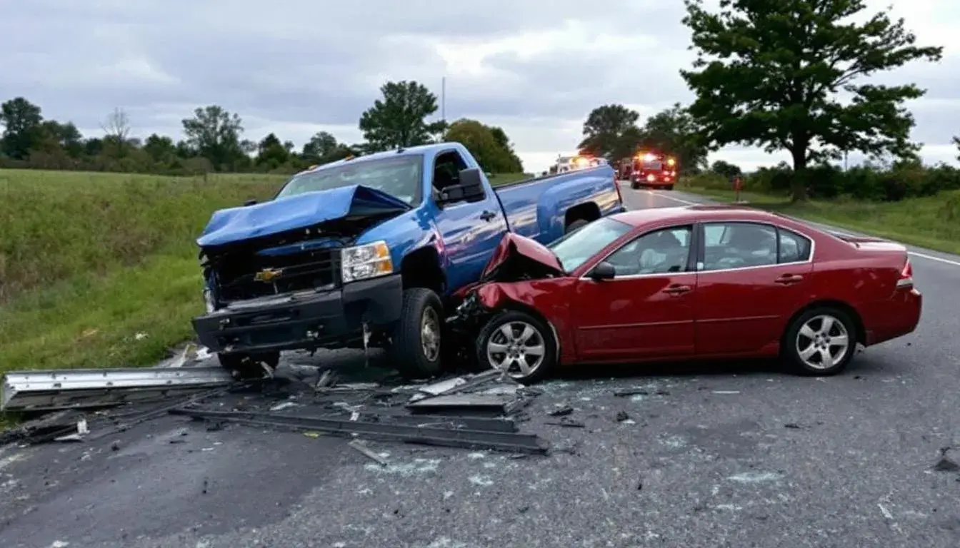 A head-on collision car accident in Bucks County, Pennsylvania, shows two damaged vehicles on the roadside, with debris scattered around. This scene highlights the potential for personal injury and the importance of seeking legal representation from experienced car accident lawyers to navigate the complexities of insurance claims and compensation for medical expenses and damages.