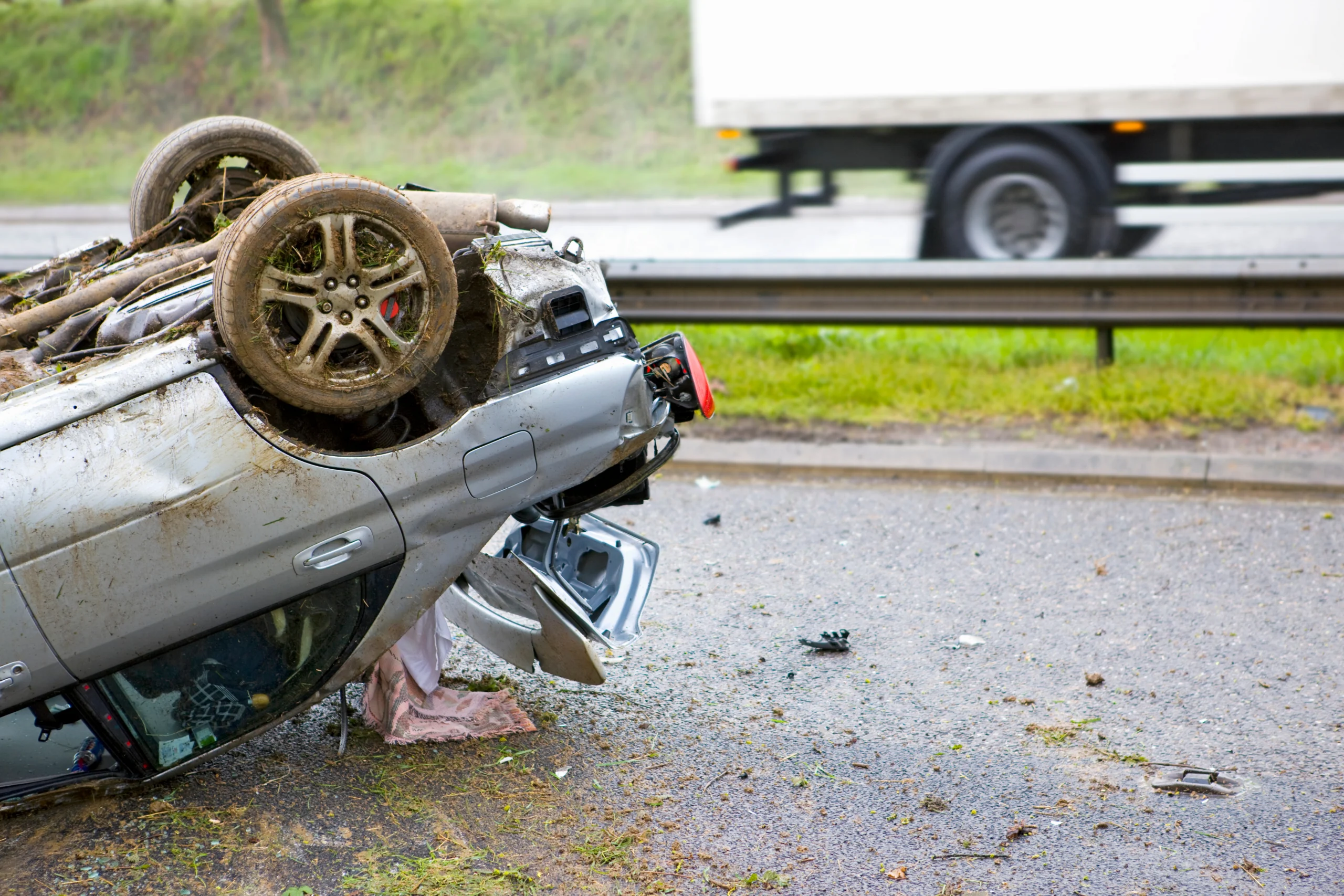 close up shot of the trunk of a car lying upside